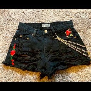 XS high waisted distressed booty shorts with rose patches and gold chains
